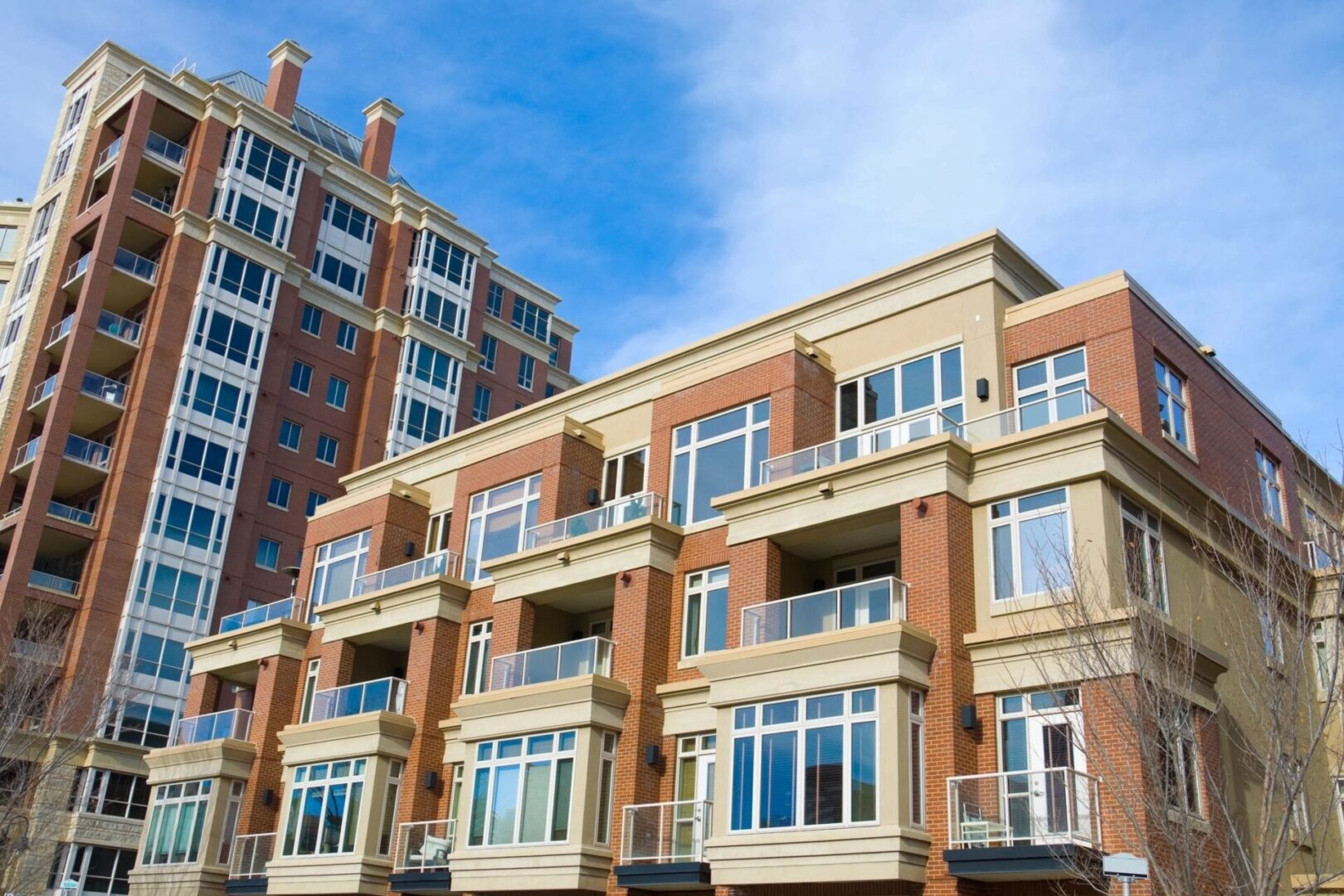 A building with many windows and balconies on the side.